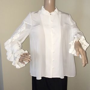 A very pretty off White Alexis silk blouse.
